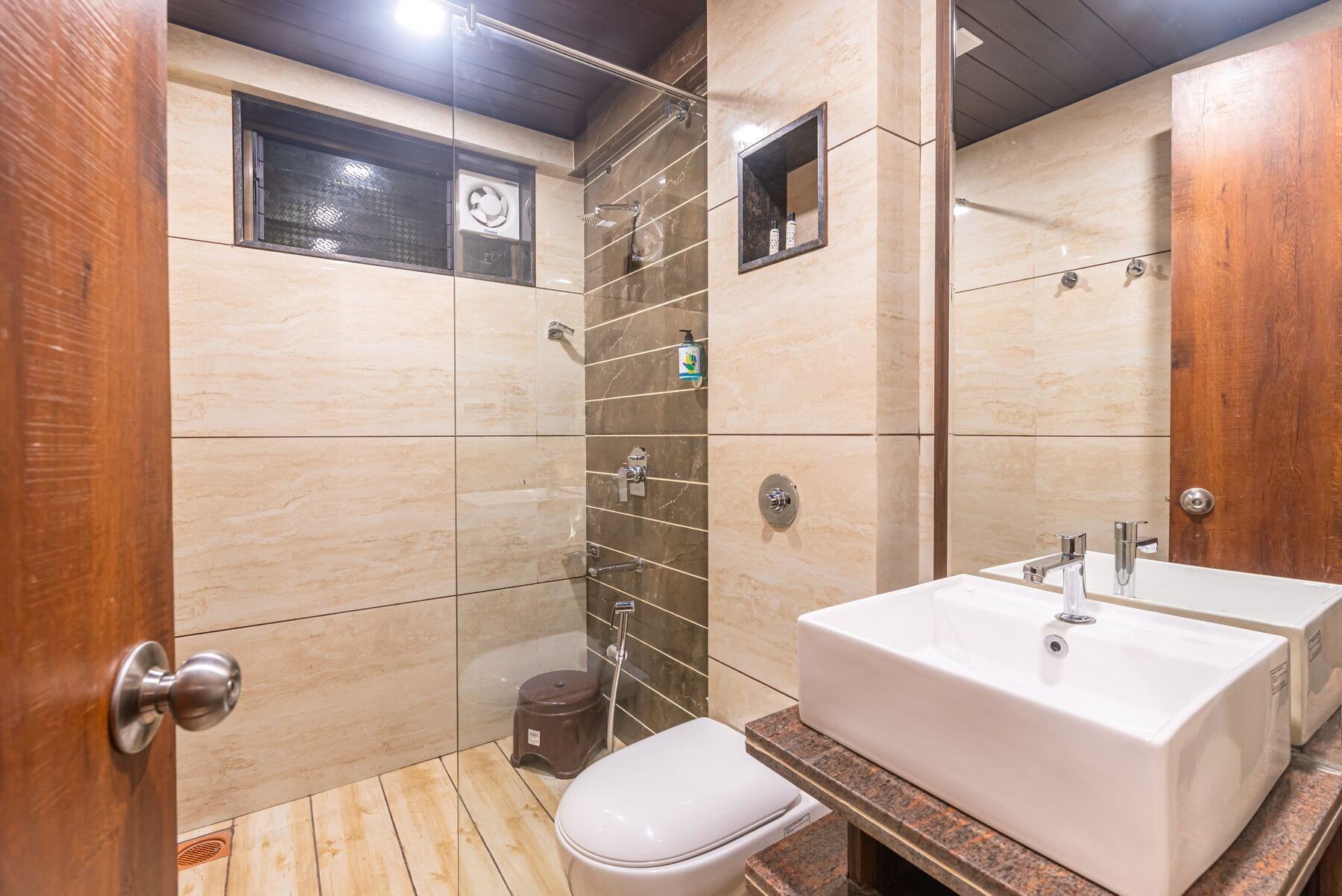 The Executive bathroom with a glass-partitioned shower