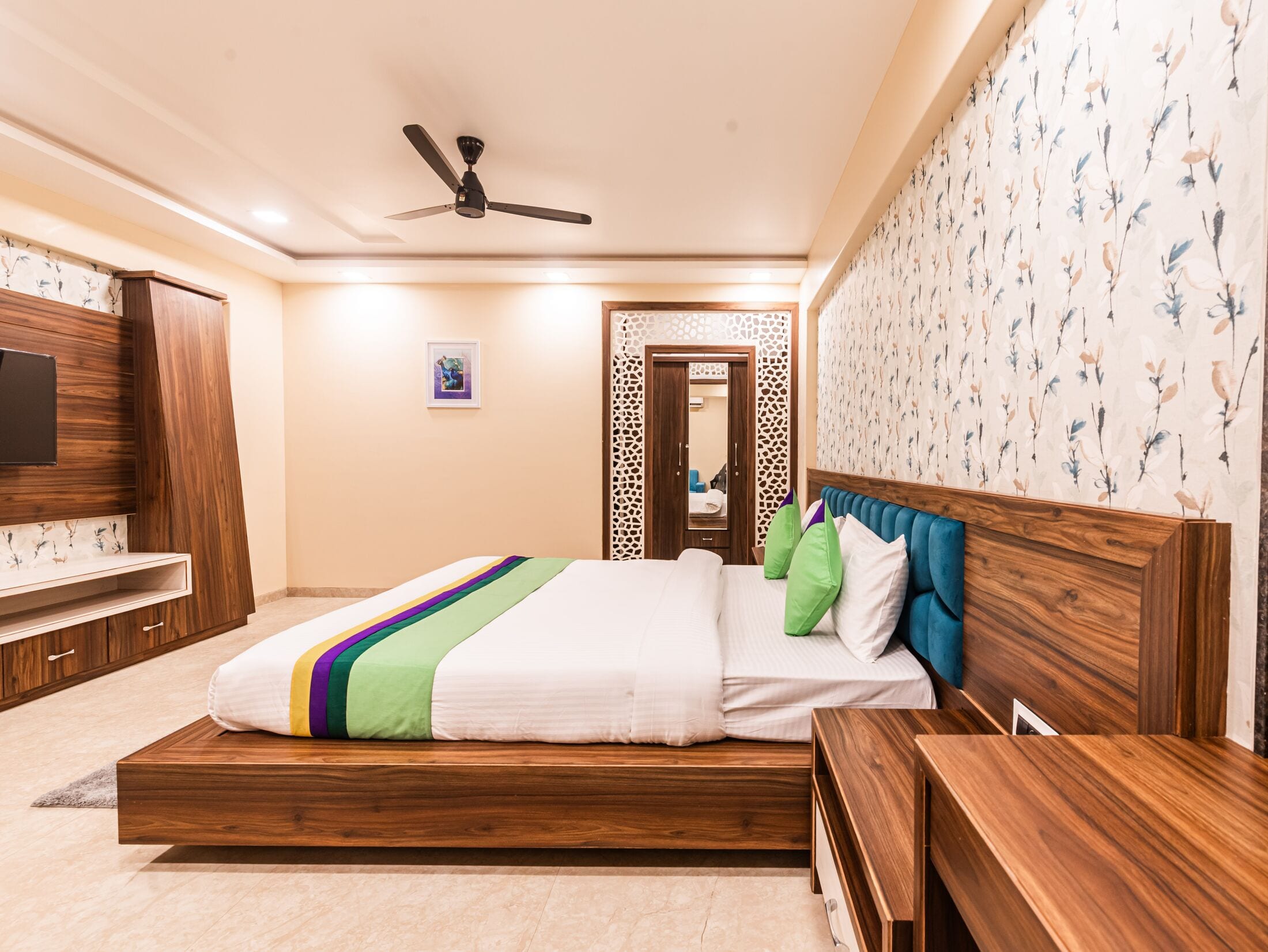 The Suite's walnut TV wall and wardrobe