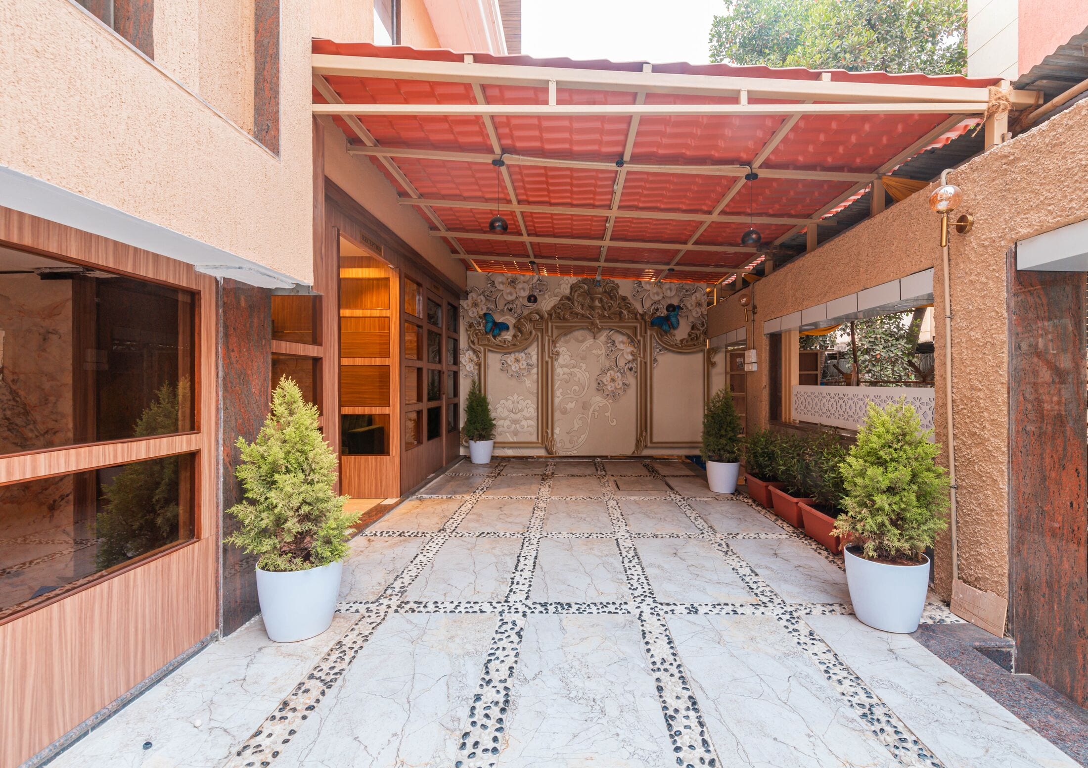 The stone courtyard leading to the reception doors