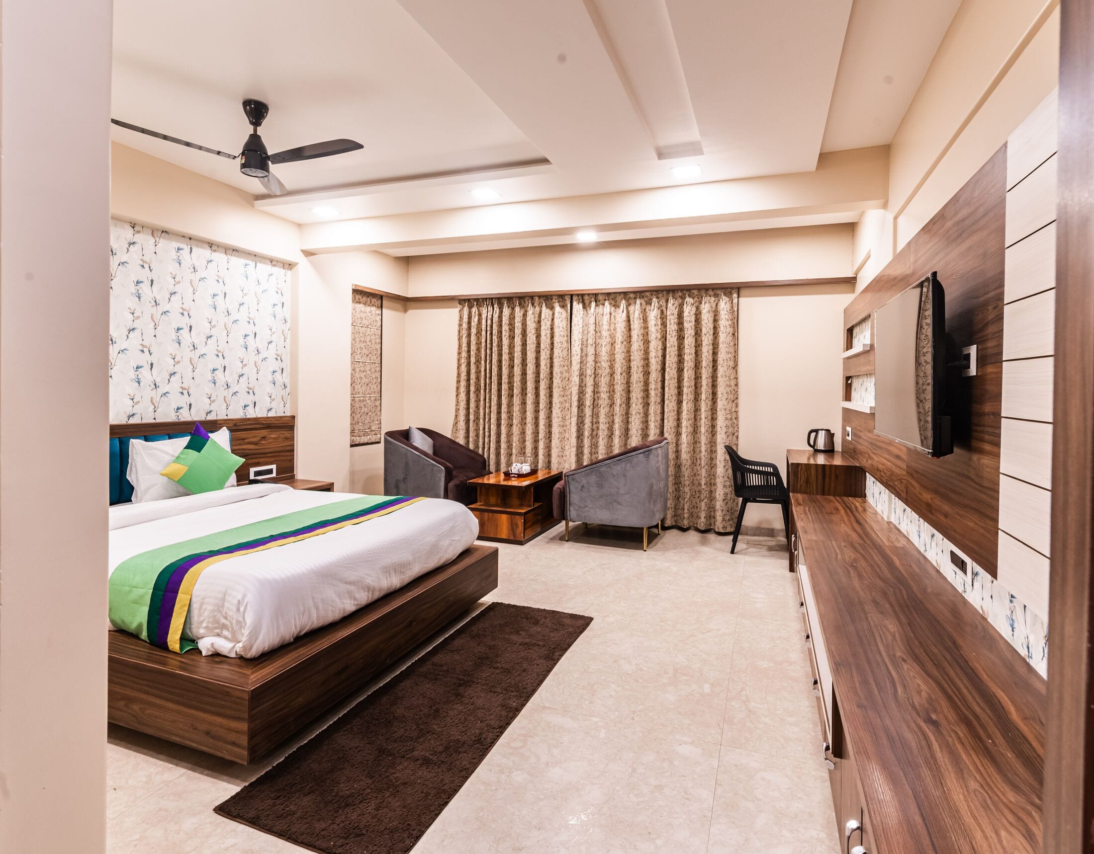The Super Deluxe room with its full-wall walnut media unit